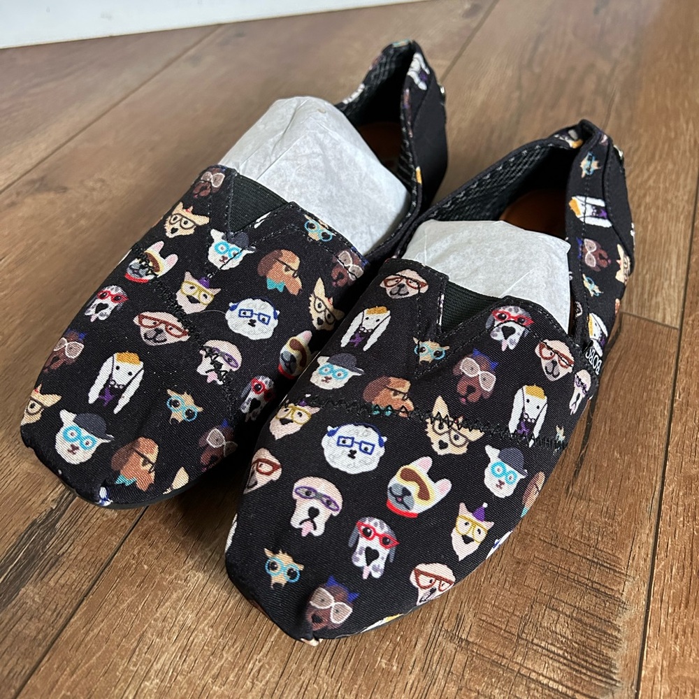 Skechers Women’s flats.  Cute dog pattern with black background.  Size 9.